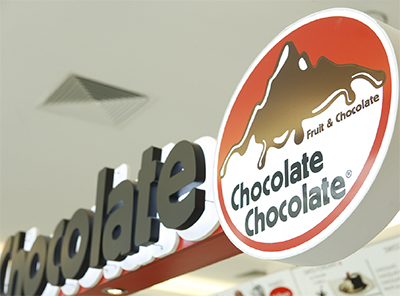 store sign with chocolate mountain
